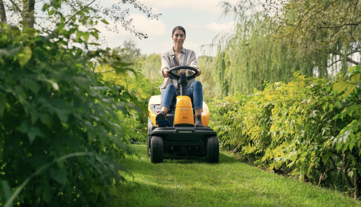 STIGA ride-on mower in a green garden